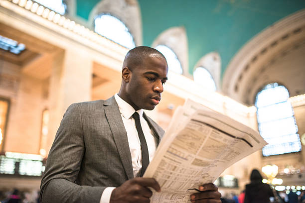 business man portrait reading news
